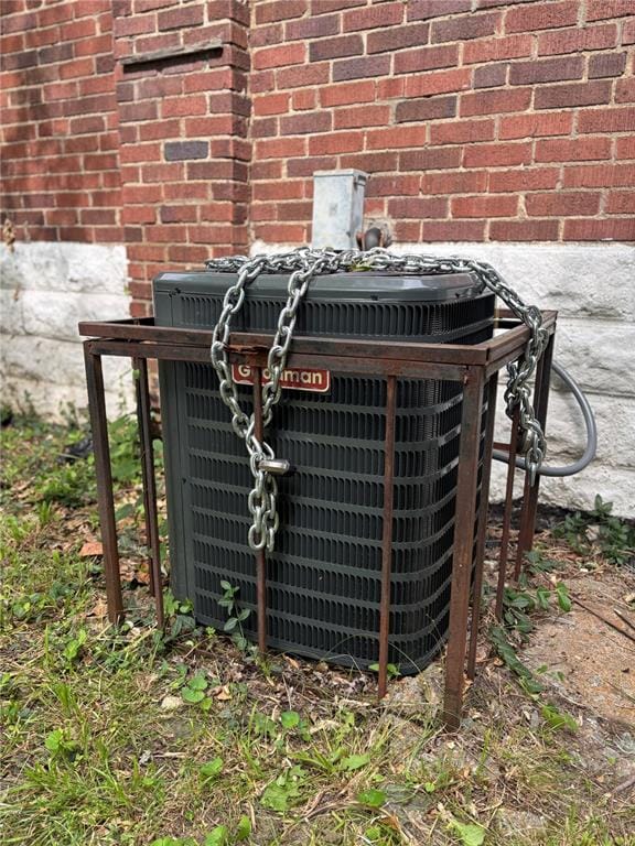 8324 Strathmore Pl, Jennings, MO 63136 - exterior view of central AC unit and brick siding