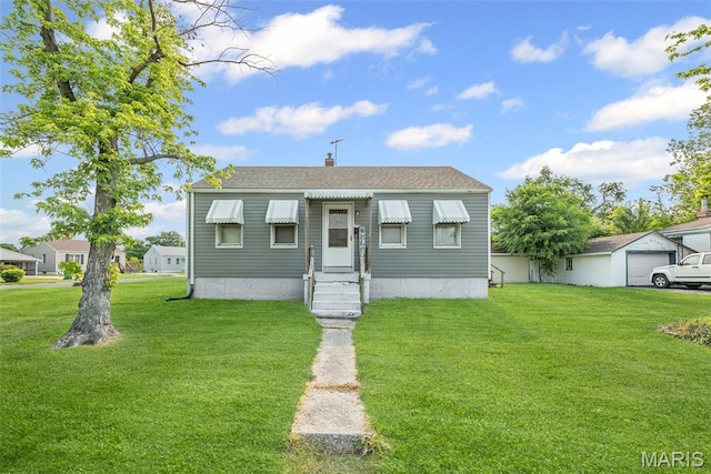 100 Bonds Ave, East Alton, IL 62024 - view of front of home featuring a front yard, entry steps, and a chimney