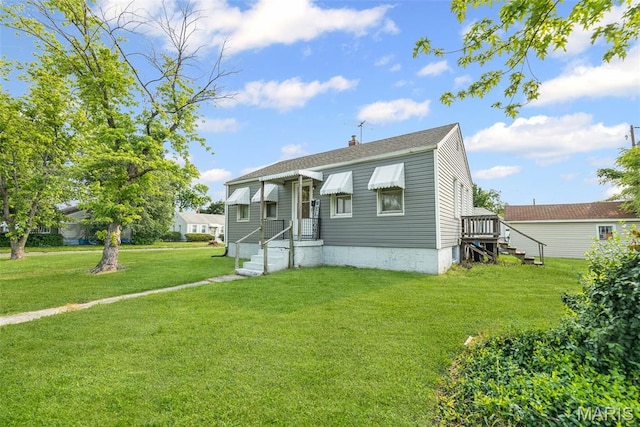 100 Bonds Ave, East Alton, IL 62024 - view of front of property with a chimney, a front lawn, and a shingled roof