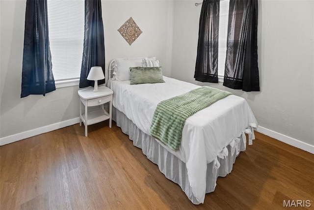 100 Bonds Ave, East Alton, IL 62024 - bedroom with baseboards and wood finished floors