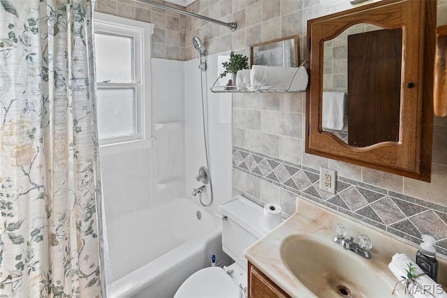 100 Bonds Ave, East Alton, IL 62024 - bathroom featuring vanity, shower / tub combo, toilet, tasteful backsplash, and tile walls