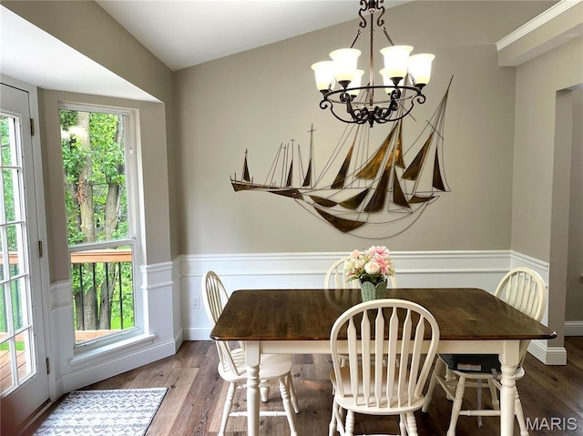259 Jacob Ln, Ballwin, MO 63021 - dining space featuring a wainscoted wall, a chandelier, wood finished floors, and a decorative wall