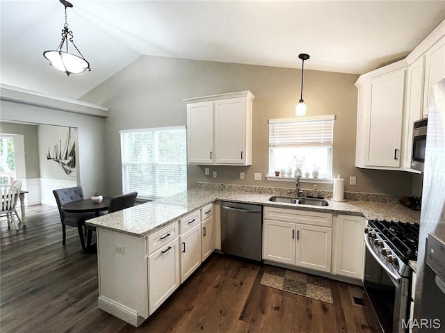 259 Jacob Ln, Ballwin, MO 63021 - kitchen with stainless steel appliances, a sink, a peninsula, white cabinets, and lofted ceiling