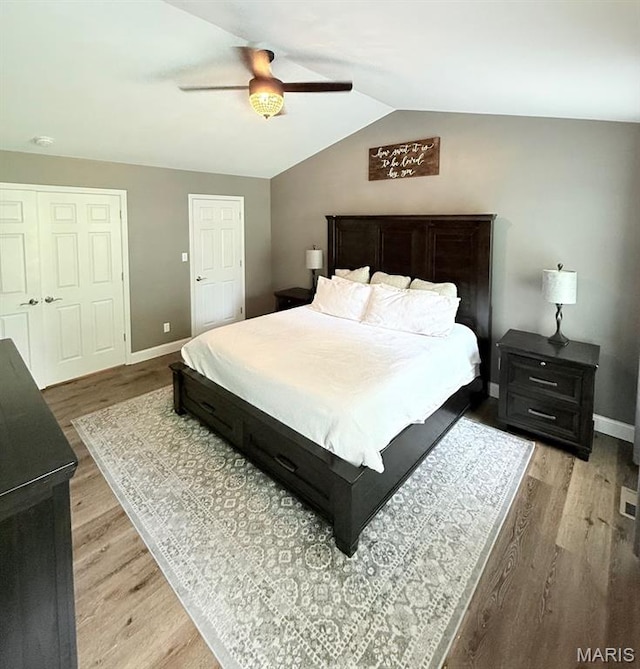 259 Jacob Ln, Ballwin, MO 63021 - bedroom featuring light wood finished floors, baseboards, lofted ceiling, and ceiling fan