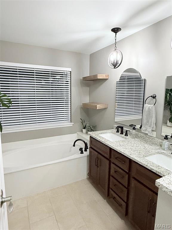 259 Jacob Ln, Ballwin, MO 63021 - full bath featuring double vanity, a garden tub, and tile patterned flooring