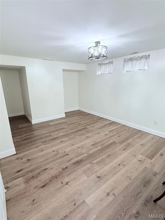 259 Jacob Ln, Ballwin, MO 63021 - unfurnished dining area featuring wood finished floors and baseboards