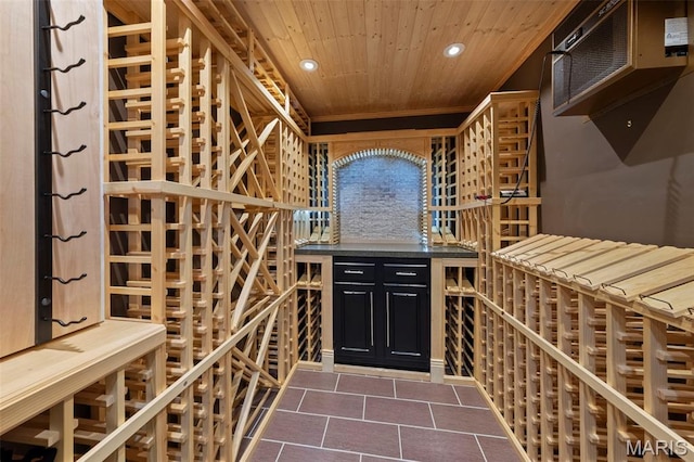 16434 Wilson Farm Dr, Chesterfield, MO 63005 - wine room featuring dark tile patterned flooring, recessed lighting, and wooden ceiling