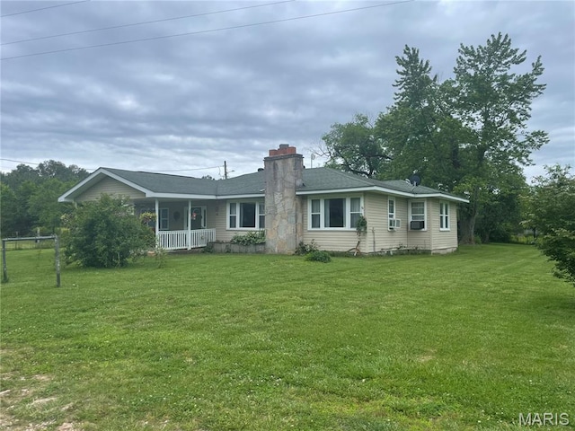 623 County Road 6590, Salem, MO 65560 - view of front of property with a chimney, a front lawn, a porch, and a shingled roof