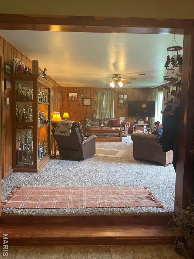 623 County Road 6590, Salem, MO 65560 - living area featuring wooden walls, carpet floors, and ceiling fan