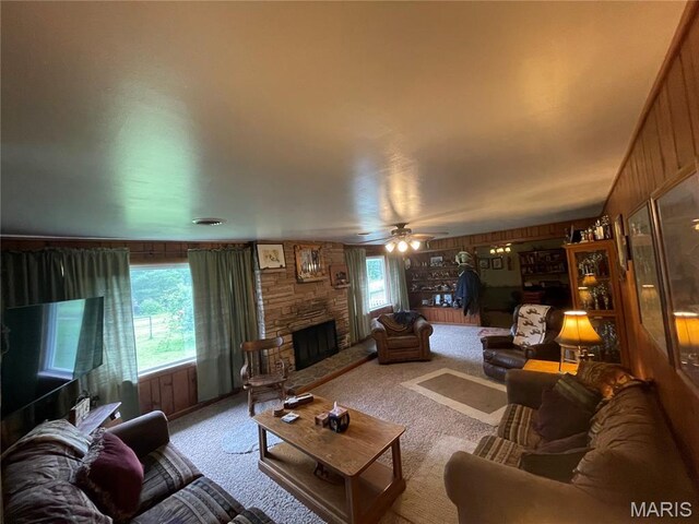 623 County Road 6590, Salem, MO 65560 - carpeted living area featuring a stone fireplace and ceiling fan