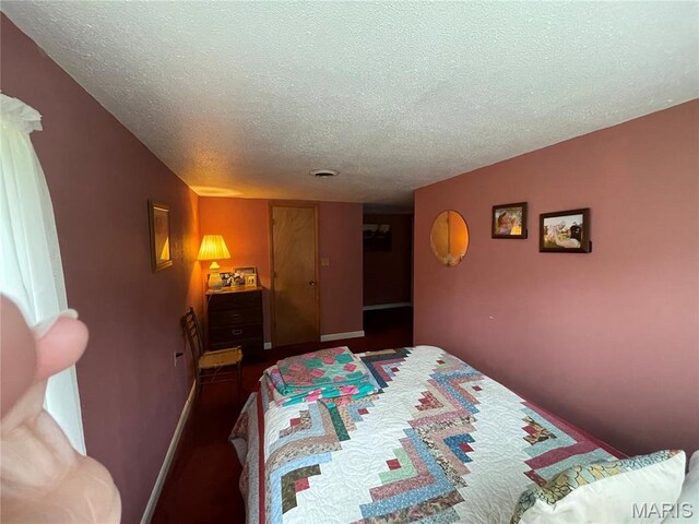 623 County Road 6590, Salem, MO 65560 - bedroom featuring a textured ceiling and baseboards