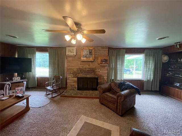 623 County Road 6590, Salem, MO 65560 - carpeted living room with a stone fireplace and a ceiling fan
