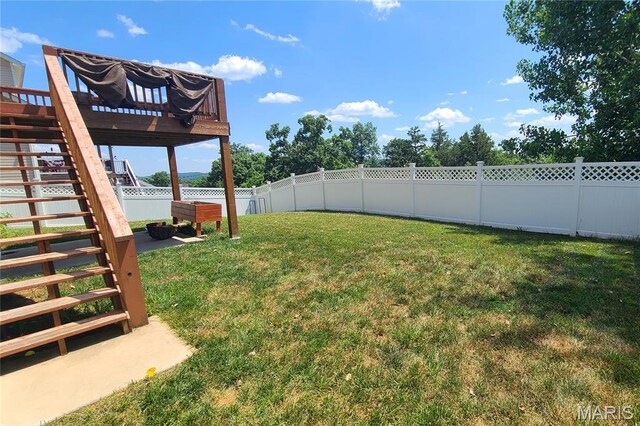 1030 Remington Dr, Imperial, MO 63052 - fenced backyard featuring stairs and a deck