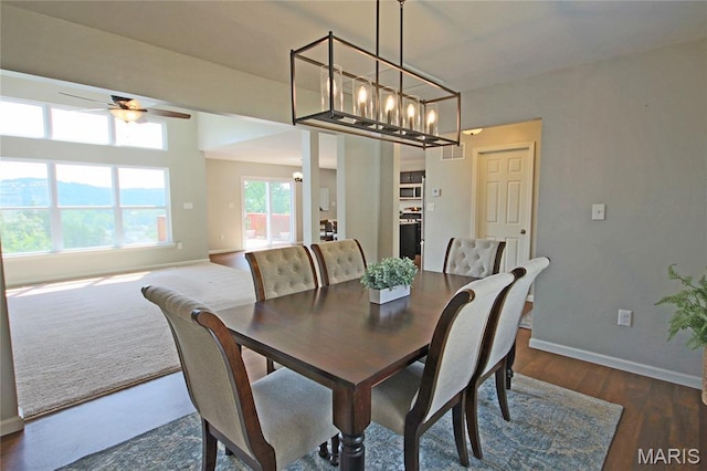 1030 Remington Dr, Imperial, MO 63052 - dining room with ceiling fan, dark wood-style flooring, and a chandelier