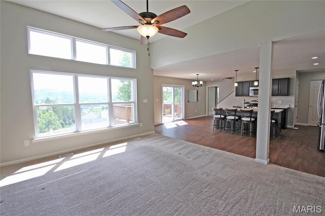 1030 Remington Dr, Imperial, MO 63052 - living area with dark carpet and ceiling fan