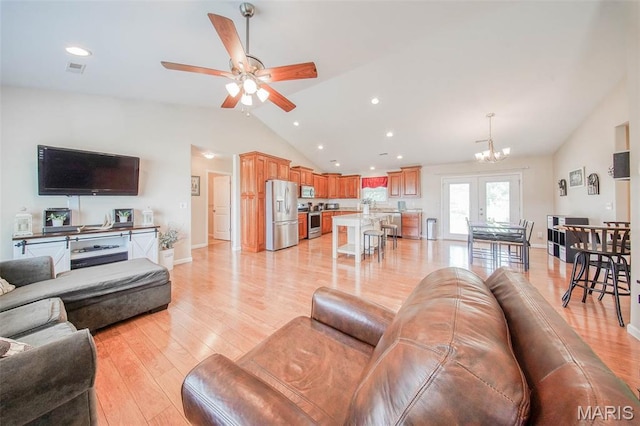 11195 Lexington Ln, Rolla, MO 65401 - living room featuring vaulted ceiling, light wood finished floors, a chandelier, ceiling fan, and recessed lighting