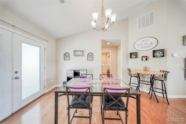 11195 Lexington Ln, Rolla, MO 65401 - dining room with vaulted ceiling, light wood-style floors, healthy amount of natural light, a chandelier, and baseboards