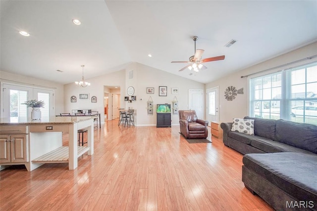 11195 Lexington Ln, Rolla, MO 65401 - living area featuring lofted ceiling, ceiling fan, light wood finished floors, a chandelier, and recessed lighting