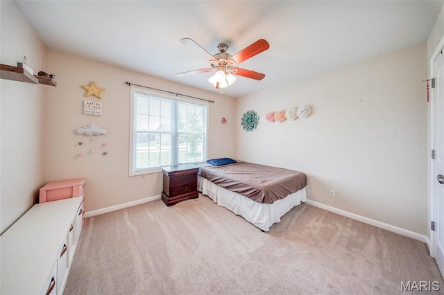 11195 Lexington Ln, Rolla, MO 65401 - bedroom with light colored carpet, baseboards, and a ceiling fan