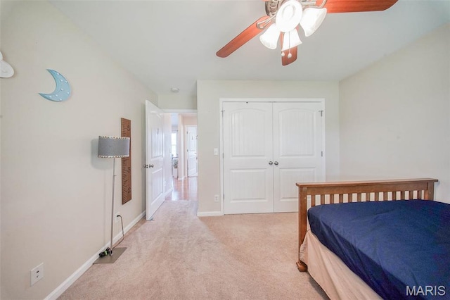 11195 Lexington Ln, Rolla, MO 65401 - bedroom with light carpet, a closet, baseboards, and a ceiling fan