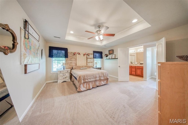 11195 Lexington Ln, Rolla, MO 65401 - bedroom with a raised ceiling, baseboards, light colored carpet, recessed lighting, and connected bathroom
