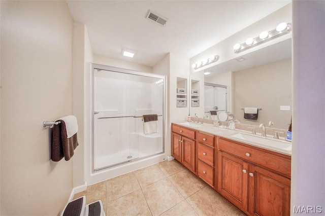11195 Lexington Ln, Rolla, MO 65401 - full bathroom featuring double vanity, a stall shower, tile patterned floors, and baseboards