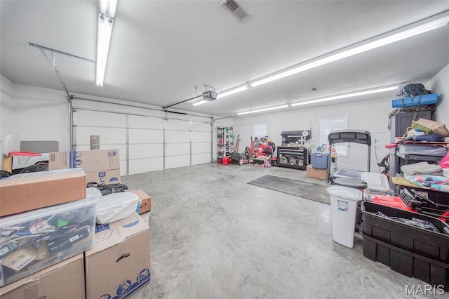 11195 Lexington Ln, Rolla, MO 65401 - garage featuring a garage door opener
