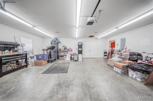 11195 Lexington Ln, Rolla, MO 65401 - garage with a garage door opener and electric panel