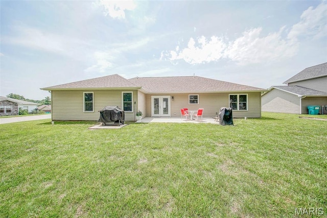 11195 Lexington Ln, Rolla, MO 65401 - back of house featuring french doors, a patio, and a lawn