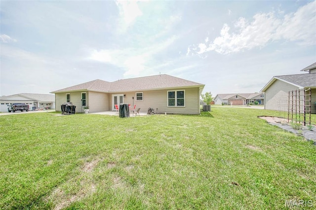 11195 Lexington Ln, Rolla, MO 65401 - back of house featuring a yard, a patio, and central AC unit