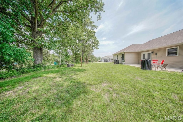 11195 Lexington Ln, Rolla, MO 65401 - view of green lawn with a patio area