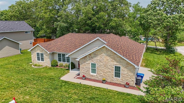 11195 Lexington Ln, Rolla, MO 65401 - view of front of home featuring stone siding, a front lawn, and a shingled roof