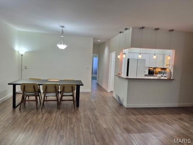 4465 W Pine Blvd Unit 15, Saint Louis, MO 63108 - dining area with dark wood finished floors