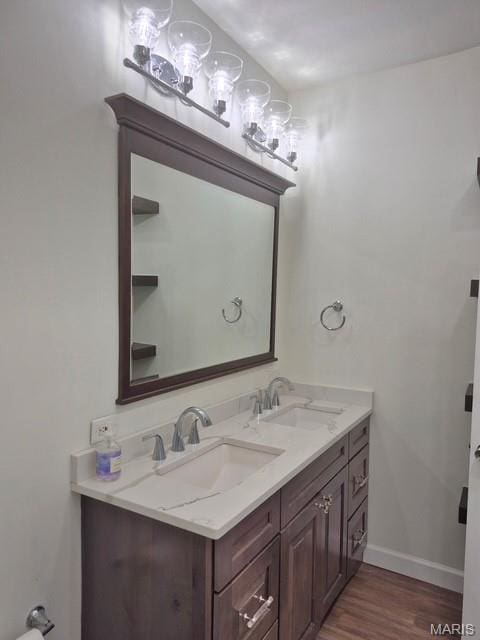 4465 W Pine Blvd Unit 15, Saint Louis, MO 63108 - bathroom with double vanity and wood finished floors