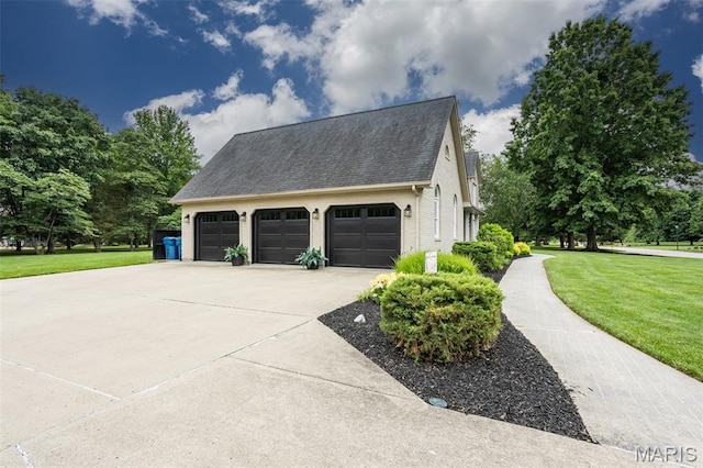 600 E Waters Edge Dr, Shiloh, IL 62221 - view of side of home with a lawn, driveway, roof with shingles, brick siding, and an attached garage