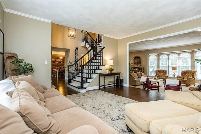 600 E Waters Edge Dr, Shiloh, IL 62221 - living area with wood finished floors, a chandelier, stairway, crown molding, and baseboards