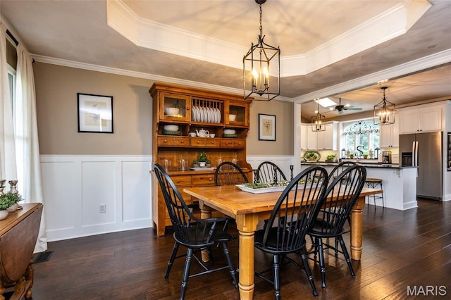 600 E Waters Edge Dr, Shiloh, IL 62221 - dining space featuring a chandelier, a raised ceiling, dark wood-type flooring, ornamental molding, and a decorative wall