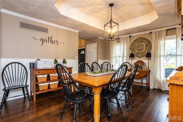 600 E Waters Edge Dr, Shiloh, IL 62221 - dining room with a raised ceiling, dark wood-type flooring, wainscoting, crown molding, and a chandelier