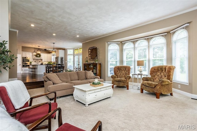 600 E Waters Edge Dr, Shiloh, IL 62221 - living area featuring crown molding, recessed lighting, baseboards, light colored carpet, and a chandelier