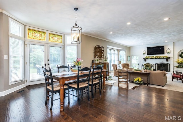 600 E Waters Edge Dr, Shiloh, IL 62221 - dining space with ornamental molding, a fireplace, hardwood / wood-style floors, a chandelier, and recessed lighting