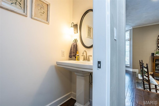 600 E Waters Edge Dr, Shiloh, IL 62221 - bathroom featuring baseboards, wood finished floors, and crown molding