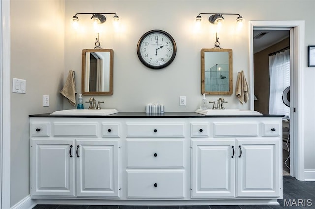600 E Waters Edge Dr, Shiloh, IL 62221 - full bathroom with double vanity and baseboards
