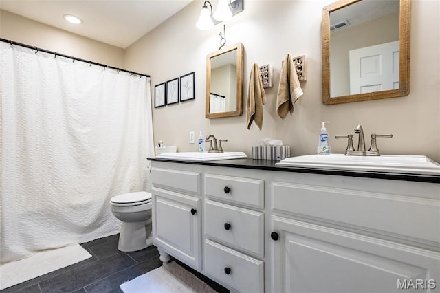 600 E Waters Edge Dr, Shiloh, IL 62221 - full bath with double vanity, toilet, curtained shower, and recessed lighting