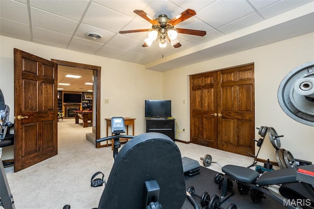 600 E Waters Edge Dr, Shiloh, IL 62221 - exercise room with a drop ceiling, light carpet, ceiling fan, and baseboards