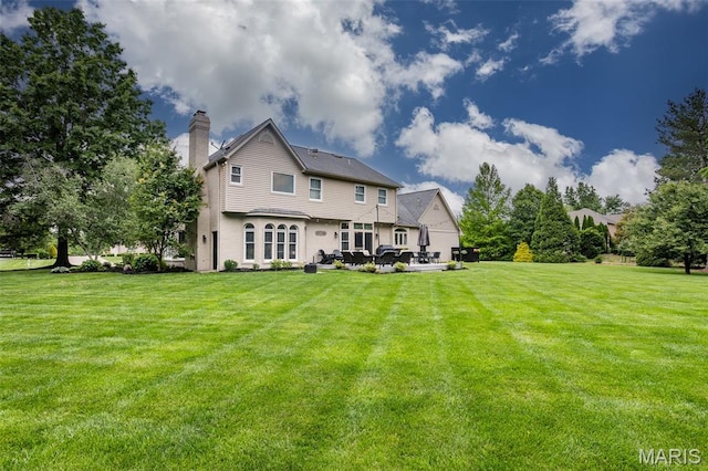 600 E Waters Edge Dr, Shiloh, IL 62221 - back of property featuring a chimney and a lawn