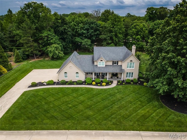 600 E Waters Edge Dr, Shiloh, IL 62221 - view of front of property featuring a porch, a front lawn, and a chimney