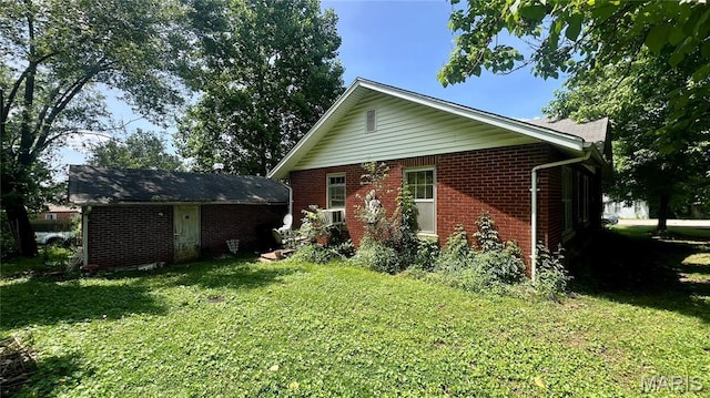 315 E College Ave, Fredericktown, MO 63645 - rear view of house with brick siding and a lawn