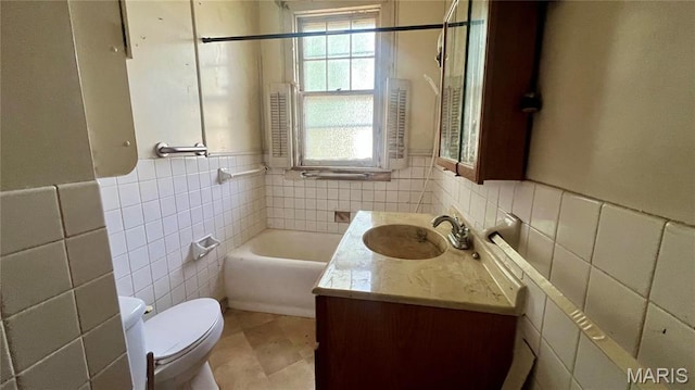 315 E College Ave, Fredericktown, MO 63645 - full bath with tile walls, toilet, healthy amount of natural light, vanity, and a bath