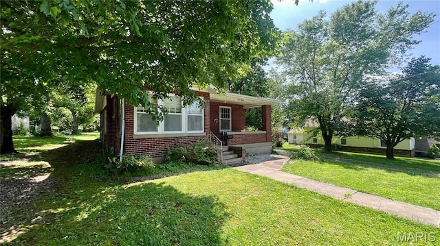 315 E College Ave, Fredericktown, MO 63645 - view of front of property with brick siding and a front lawn