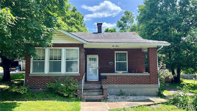 315 E College Ave, Fredericktown, MO 63645 - bungalow-style house with brick siding and a chimney